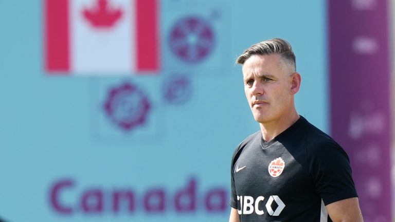 Canada head coach John Herdman watches his team during practice at the World Cup in Doha, Qatar. (CP)