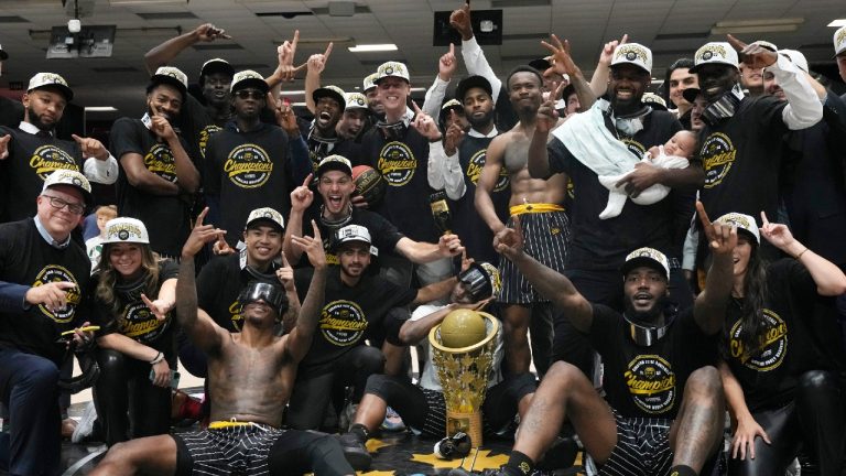 Hamilton Honey Badgers players and team members celebrate with the Championship trophy after defeating the Scarborough Shooting Stars in the CEBL championship final, Sunday, August 14, 2022 in Ottawa. Adrian Wyld/THE CANADIAN PRESS