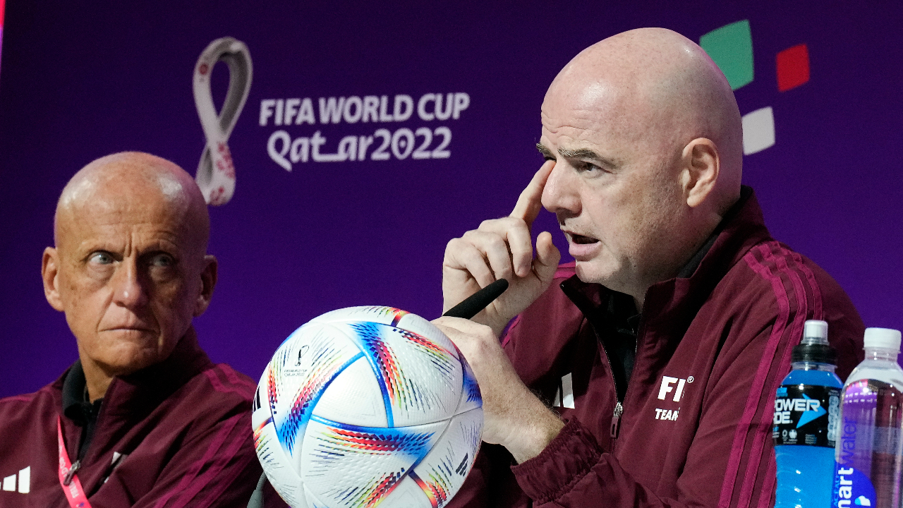 FIFA President Gianni Infantino, right, talks to the media beside Chairman of the FIFA referees committee Pierluigi Collina, left, at a press conference of the FIFA referees at the World Cup media center in Doha, Qatar, Friday, Nov. 18, 2022.(Martin Meissner/AP)