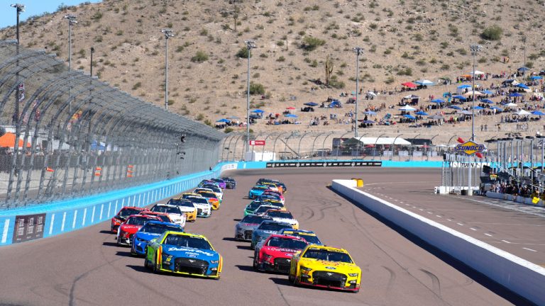 Joey Logano (22) leads the field on the parade lap during a NASCAR Cup Series auto race Sunday, Nov. 6, 2022, in Avondale, Ariz. (Rick Scuteri/AP)