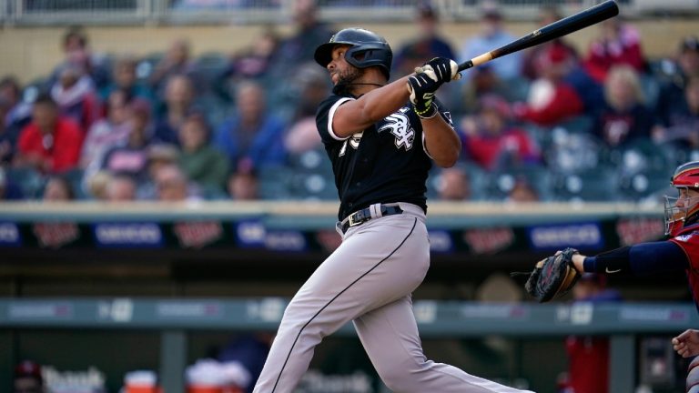 Chicago White Sox's Jose Abreu hits an RBI-double during the eighth inning of a baseball game against the Minnesota Twins, Thursday, Sept. 29, 2022, in Minneapolis. (Abbie Parr/AP)