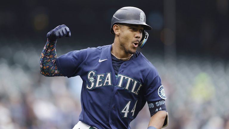 Seattle Mariners' Julio Rodriguez pumps his fist as he runs the bases after hitting a solo home run against the Detroit Tigers on Wednesday, Oct. 5, 2022, in Seattle. (John Froschauer/AP)