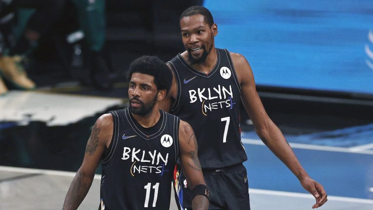 Brooklyn Nets guard Kyrie Irving (11) and Kevin Durant react against the Boston Celtics in the second half of Game 5 during an NBA basketball first-round playoff series, June 1, 2021, in New York. Kevin Durant said Friday, Nov. 4, 2022, the Brooklyn Nets could have handled this tumultuous week a bit differently — a week in which his coach was fired and teammate Kyrie Irving was suspended for posting a link to an antisemitic work. (Adam Hunger/AP, File)