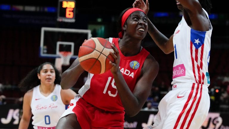 Canada's Laeticia Amihere, left, attempts to get past Puerto Rico's Mya Hollingshed during their quarterfinal game at the women's Basketball World Cup in Sydney, Australia, Thursday, Sept. 29, 2022. (Mark Baker/AP)