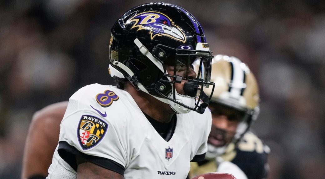 Baltimore Ravens quarterback Anthony Brown scrambles for a first