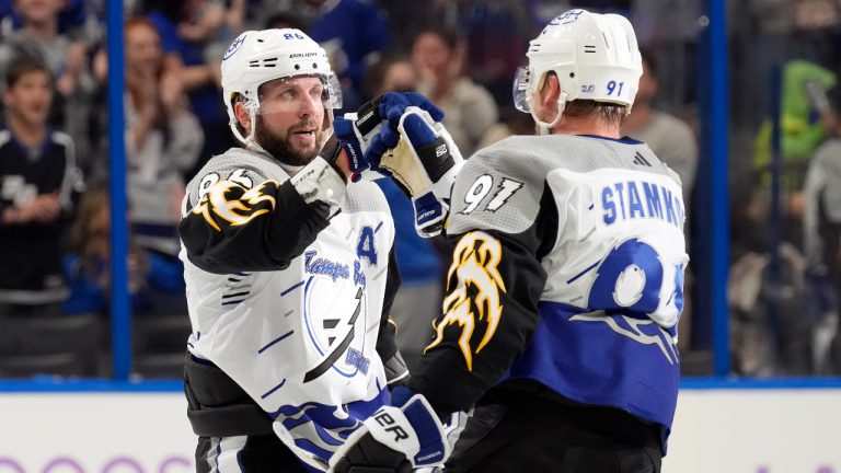 Tampa Bay Lightning right wing Nikita Kucherov (86) celebrates his goal against the Calgary Flames with center Steven Stamkos (91) during the second period of an NHL hockey game Thursday, Nov. 17, 2022, in Tampa, Fla. (Chris O'Meara/AP)