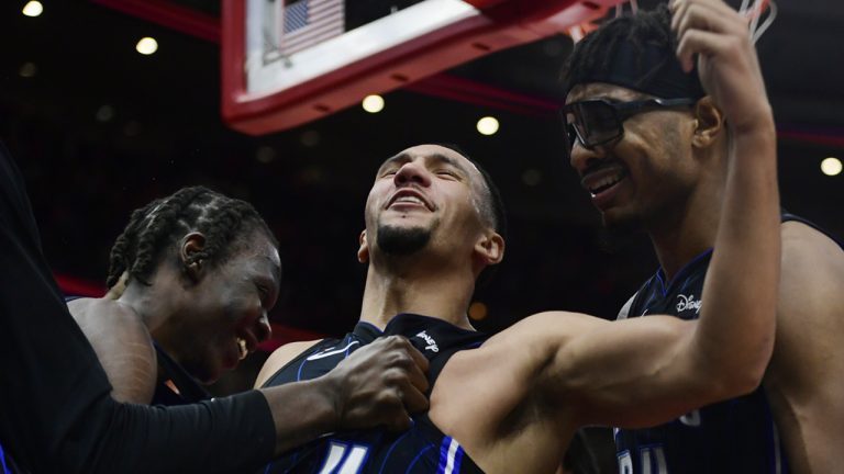 Orlando Magic's Jalen Suggs (4) celebrates with teammates Wendell Carter Jr (34) and Mo Bamba, left, after scoring the winning basket to defeat the Chicago Bulls in an NBA basketball game Friday, Nov. 18, 2022, in Chicago. (Paul Beaty/AP)