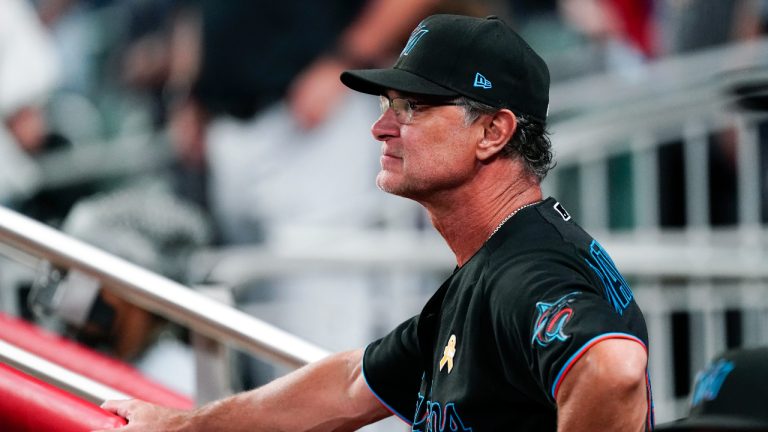 Former Miami Marlins manager Don Mattingly looks on from the dugout during a baseball game against the Atlanta Braves. (John Bazemore/AP)