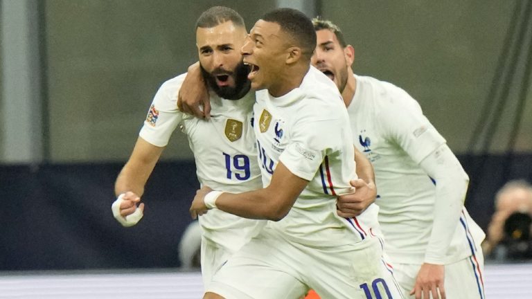 France's Karim Benzema, left, celebrates with teammate France's Kylian Mbappe after scoring during the UEFA Nations League final soccer match between France and Spain at the San Siro stadium, in Milan, Italy, Sunday, Oct. 10, 2021. (Luca Bruno/AP)