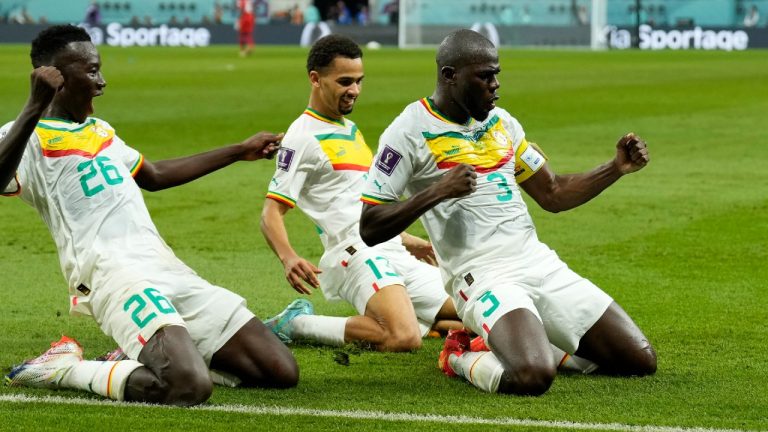 Senegal's Kalidou Koulibaly, right, celebrates with teammates scoring his side's second goal during the World Cup group A soccer match between Ecuador and Senegal, at the Khalifa International Stadium in Doha, Qatar, Tuesday, Nov. 29, 2022. (Francisco Seco/AP)