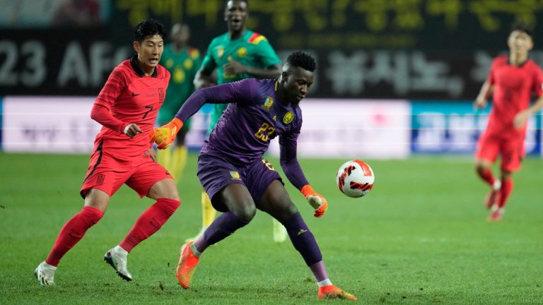 Cameroon's goalkeeper Andre Onana tries to kick the ball away as South Korea's Son Heung-min, left, challenges during the friendly soccer match between South Korea and Cameroon at Seoul World Cup Stadium in Seoul, South Korea, Tuesday, Sept. 27, 2022. (Lee Jin-man/AP)