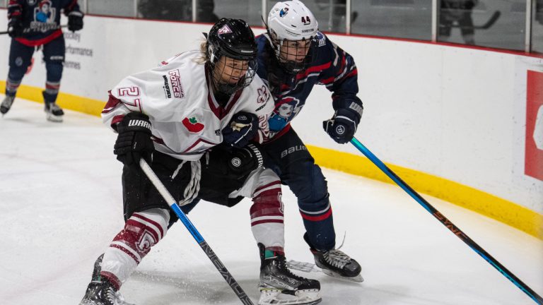 Montreal Force's Jade Downie-Landry battles with Metropolitan Riveters' Taylor Marchin during Premier Hockey Federation action in Montreal in this Saturday, Nov. 26, 2022 handout photo. (Arianne Bergeron, Karyzma Agency/CP)