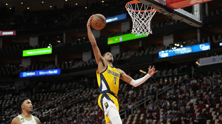 Indiana Pacers' Tyrese Haliburton goes up to dunk the ball against the Houston Rockets during the first half on Friday, Nov. 18, 2022, in Houston. (David J. Phillip/AP)