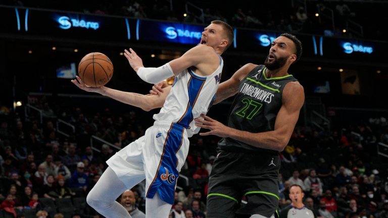 Washington Wizards centre Kristaps Porzingis, left, is fouled by Minnesota Timberwolves centre Rudy Gobert (27) during the first half of an NBA basketball game, Monday, Nov. 28, 2022, in Washington. (Jess Rapfogel/AP Photo)