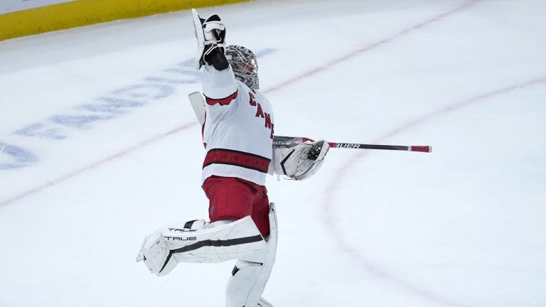 Carolina Hurricanes goaltender Pyotr Kochetkov celebrates after his team's shutout of the Chicago Blackhawks in an NHL hockey game Monday, Nov. 14, 2022, in Chicago. (Charles Rex Arbogast/AP)