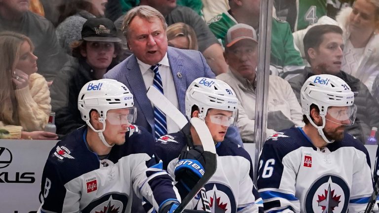 Winnipeg Jets head coach Rick Bowness, top, talks from the bench. (LM Otero/AP)