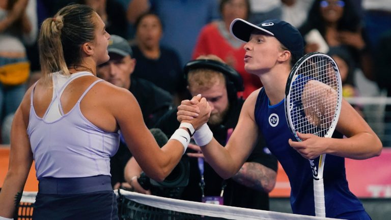 Iga Swiatek, right, of Poland, congratulates Aryna Sabalenka, of Belarus, after their match in the singles semifinals of the WTA Finals tennis tournament in Fort Worth, Texas, Sunday, Nov. 6, 2022. (LM Otero/AP)