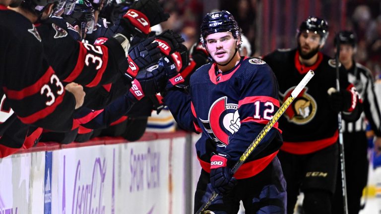 Ottawa Senators right wing Alex DeBrincat (12) celebrates a goal against the Buffalo Sabres. (Justin Tang/CP)