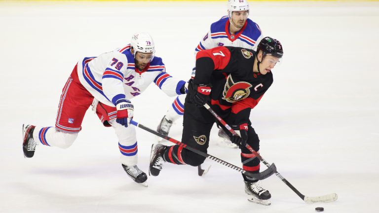 New York Rangers' K'Andre Miller (79) and Chris Kreider (20) chase Ottawa Senators' Brady Tkachuk (7) during first period NHL hockey action in Ottawa on Wednesday, November 30, 2022. (Patrick Doyle/CP)