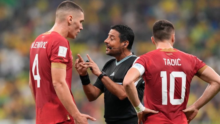 Referee Alireza Faghani speaks to Serbia's Nikola Milenkovic during the World Cup group stage match between Brazil and Serbia, at the Lusail Stadium in Lusail, Qatar, Thursday, Nov. 24, 2022. (Themba Hadebe/AP Photo)