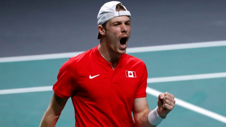 Canada's Denis Shapovalov reacts as he plays Australia's Thanasi Kokkinakis during the final Davis Cup tennis match between Australia and Canada in Malaga, Spain, Sunday, Nov. 27, 2022. (Joan Monfort/AP)