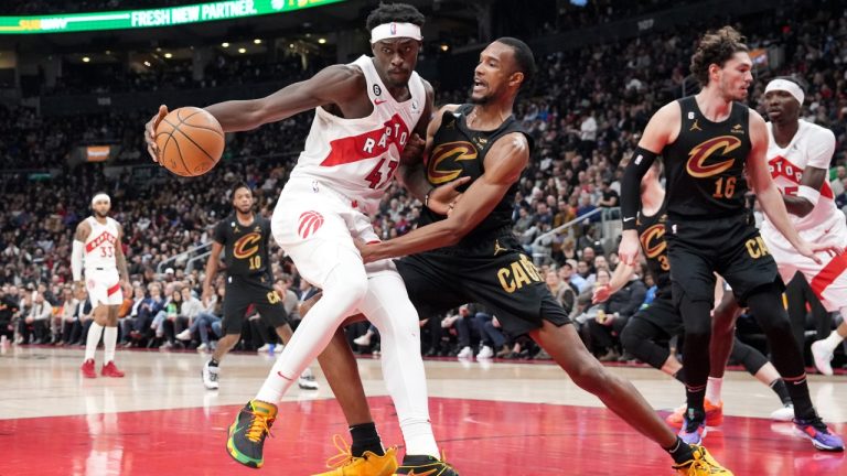 Toronto Raptors’ Pascal Siakam (43) shields the ball from Cleveland Cavaliers’ Evan Mobley during first half NBA basketball action in Toronto, Monday, Nov. 28, 2022. (Chris Young/The Canadian Press)