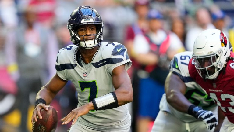 Seattle Seahawks quarterback Geno Smith (7) passes against the Arizona Cardinals during the first half of an NFL football game in Glendale, Ariz., Sunday, Nov. 6, 2022. (Matt York/AP Photo)