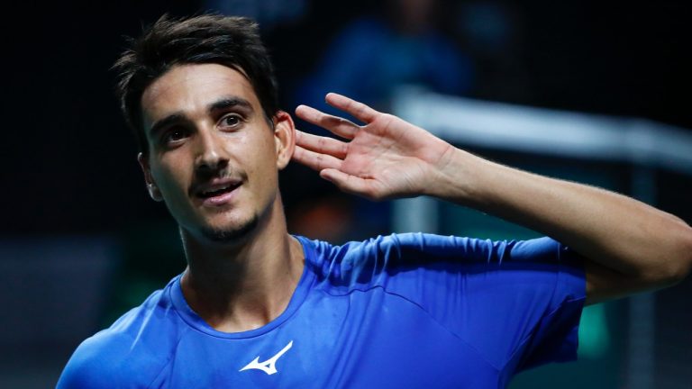 Italy's Lorenzo Sonego celebrates after defeating Frances Tiafoe of the USA during a Davis Cup quarter-final tennis match between Italy and USA in Malaga, Spain, Thursday, Nov. 24, 2022. (Joan Monfort/AP)