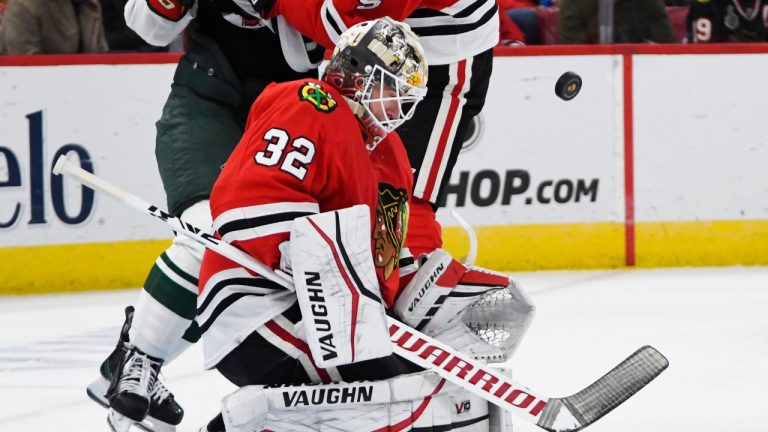 Chicago Blackhawks goalie Alex Stalock (32) makes a save during the second period of an NHL hockey game against the Minnesota Wild, Sunday, Oct. 30, 2022, in Chicago. (Paul Beaty/AP Photo)