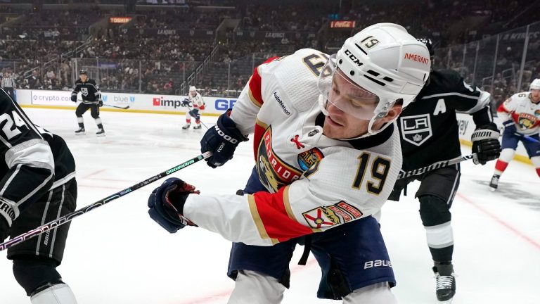 Los Angeles Kings center Phillip Danault, left, and Florida Panthers left wing Matthew Tkachuk battle for the puck during the first period of an NHL hockey game Saturday, Nov. 5, 2022, in Los Angeles. (Mark J. Terrill/AP)