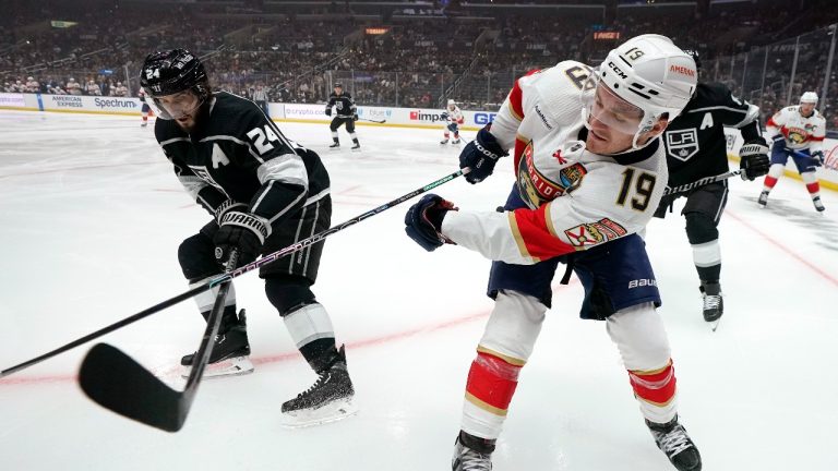 Los Angeles Kings center Phillip Danault, left, and Florida Panthers left wing Matthew Tkachuk battle for the puck during the first period of an NHL hockey game Saturday, Nov. 5, 2022, in Los Angeles. (Mark J. Terrill/AP Photo)