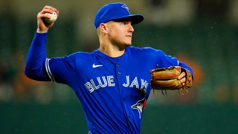 Toronto Blue Jays third baseman Matt Chapman attempts to throw out Baltimore Orioles' Jorge Mateo at first base on a bunt single during the third inning of a baseball game, Monday, Oct. 3, 2022, in Baltimore. (Julio Cortez/AP)