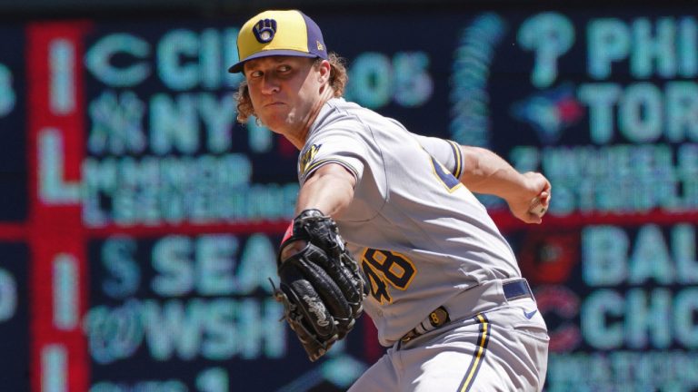 Milwaukee Brewers pitcher Trevor Gott (48) throws in relief of starter Aaron Ashby against the Minnesota Twins in the fifth inning of a baseball game, Wednesday, July 13, 2022, in Minneapolis. (Jim Mone/AP)