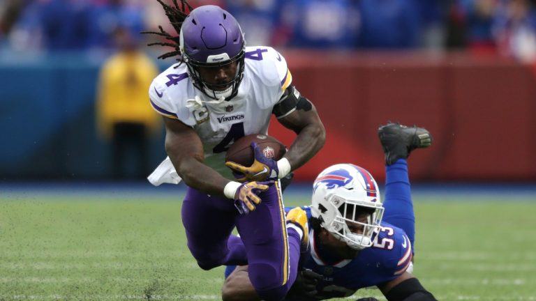 Minnesota Vikings running back Dalvin Cook (4) is brought down by Buffalo Bills linebacker Tyrel Dodson (53) in the first half of an NFL football game, Sunday, Nov. 13, 2022, in Orchard Park, N.Y. (AP Photo/Joshua Bessex)