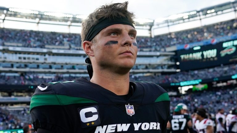 New York Jets quarterback Zach Wilson walks off the field after losing to the New England Patriots 22-17  Sunday, Oct. 30, 2022, in New York. (John Minchillo/AP Photo)