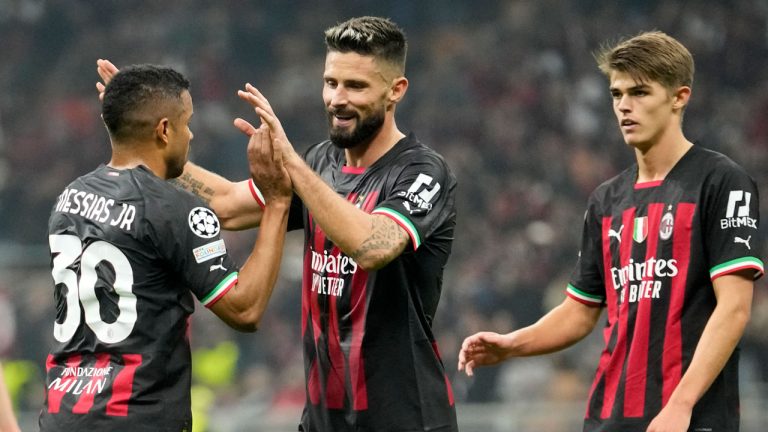 AC Milan's Junior Messias, left, celebrates with AC Milan's Olivier Giroud after scoring his side's fourth goal during the Champions League, Group E soccer match between AC Milan and FC Salzburg. (Luca Bruno/AP)