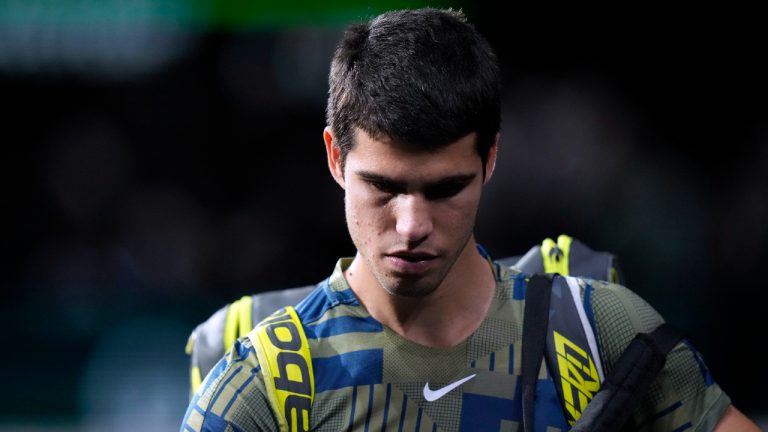 Spain's Carlos Alcaraz leaves the court after his withdrawal of the tournament during his quarterfinal match of the Paris Masters tennis tournament against Holger Rune from Denmark, at the Accor Arena, Friday, Nov. 4, 2022 in Paris. (Thibault Camus/AP)