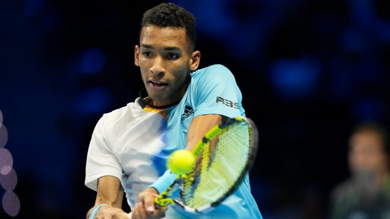 Canada's Felix Auger-Aliassime returns the ball to Norway's Casper Ruud during their singles tennis match of the ATP World Tour Finals, at the Pala Alpitour in Turin, Italy, Sunday, Nov. 13, 2022. (Antonio Calanni/AP)