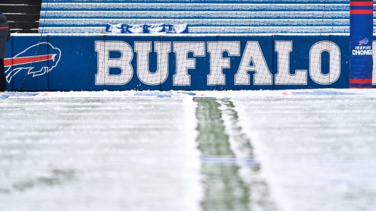 Snow covers the field at Highmark Stadium before an NFL football game. (AP Photo)