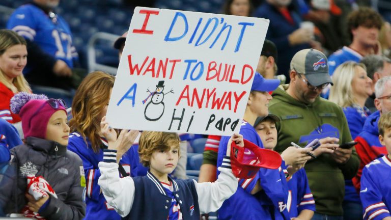 A Buffalo Bills fan holds a poster during pregame of an NFL football game against the Cleveland Browns, Sunday, Nov. 20, 2022, in Detroit. The game was originally scheduled to be played in Buffalo but was moved to Detroit because of the blizzard. (AP Photo/Duane Burleson) 