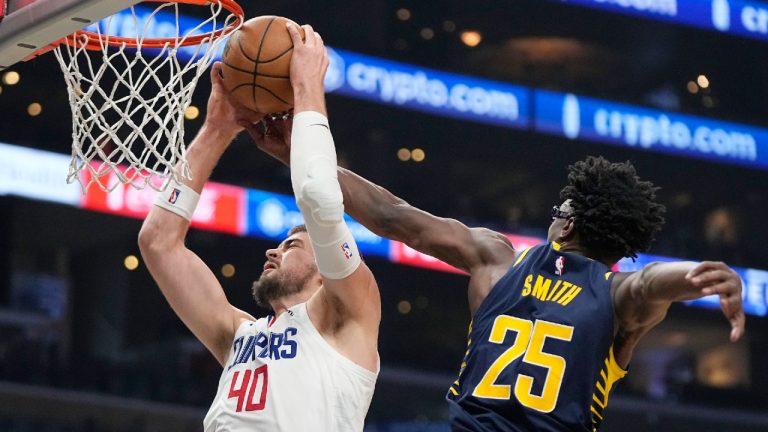 Los Angeles Clippers center Ivica Zubac, left, grabs a rebound away from Indiana Pacers forward Jalen Smith during the second half of an NBA basketball game Sunday, Nov. 27, 2022, in Los Angeles. (Mark J. Terrill/AP)