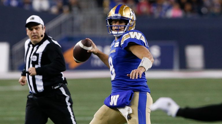 Winnipeg Blue Bombers quarterback Zach Collaros (8) throws to Rasheed Bailey (88) for a touchdown against the B.C. Lions during first half CFL action in Winnipeg Friday, October 28, 2022. THE CANADIAN PRESS/John Woods