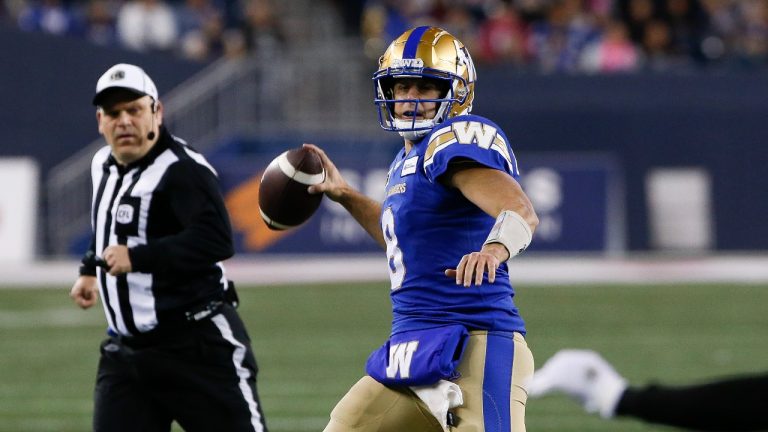 Winnipeg Blue Bombers quarterback Zach Collaros (8) throws to Rasheed Bailey (88) for a touchdown against the B.C. Lions during first half CFL action in Winnipeg Friday, October 28, 2022. THE CANADIAN PRESS/John Woods