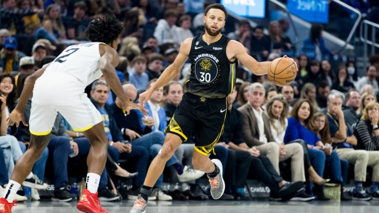 Golden State Warriors guard Stephen Curry (30) passes past Utah Jazz guard Collin Sexton (2) during the first half of an NBA basketball game in San Francisco, Friday, Nov. 25, 2022. (John Hefti/AP)