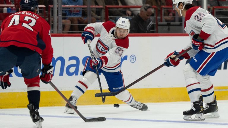 Montreal Canadiens right wing Evgenii Dadonov (63) passes the puck past defenceman Johnathan Kovacevic (26) and Washington Capitals defenseman Martin Fehervary (42) during the first period of an NHL hockey game, Wednesday, Oct. 5, 2022, in Washington. (Jess Rapfogel/AP)