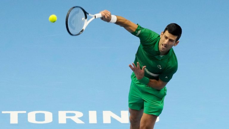 Serbia's Novak Djokovic returns the ball. (Antonio Calanni/AP)