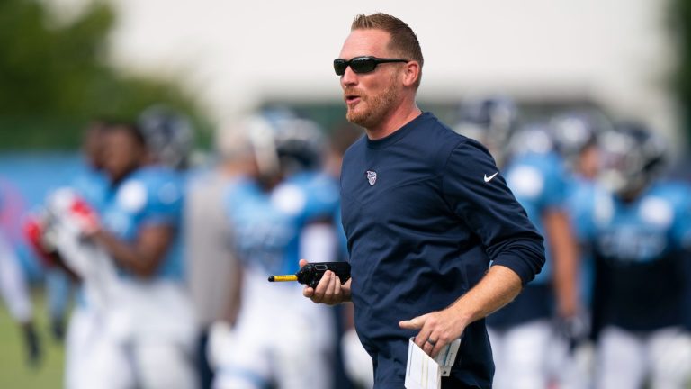 Tennessee Titans offensive coordinator Todd Downing jogs across the field during NFL football training camp, Tuesday, Aug. 2, 2022, in Nashville, Tenn. (George Walker IV/The Tennessean via AP)