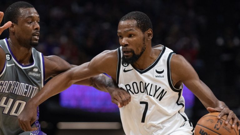 Brooklyn Nets forward Kevin Durant (7) is defended by Sacramento Kings forward Harrison Barnes (40) in the first quarter of an NBA basketball game in Sacramento, Calif., Tuesday, Nov. 15, 2022. (AP Photo/JosÃ© Luis Villegas)