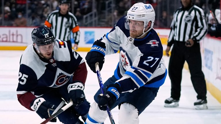 Winnipeg Jets left wing Nikolaj Ehlers (27) skates against Colorado Avalanche right wing Logan O'Connor (25) during the third period of an NHL hockey game Thursday, Jan. 6, 2022, in Denver. (Jack Dempsey/AP)