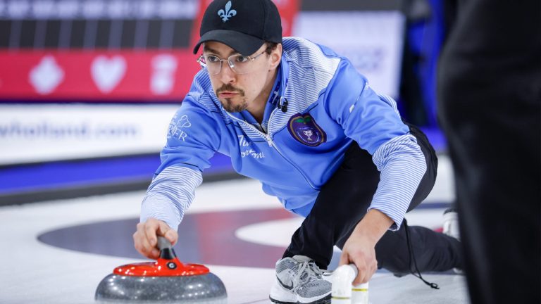 Team Quebec fourth Felix Asselin makes a shot while playing Team Wild Card Three at the Tim Hortons Brier in Lethbridge, Alta., Sunday, March 6, 2022. (Jeff McIntosh/CP)